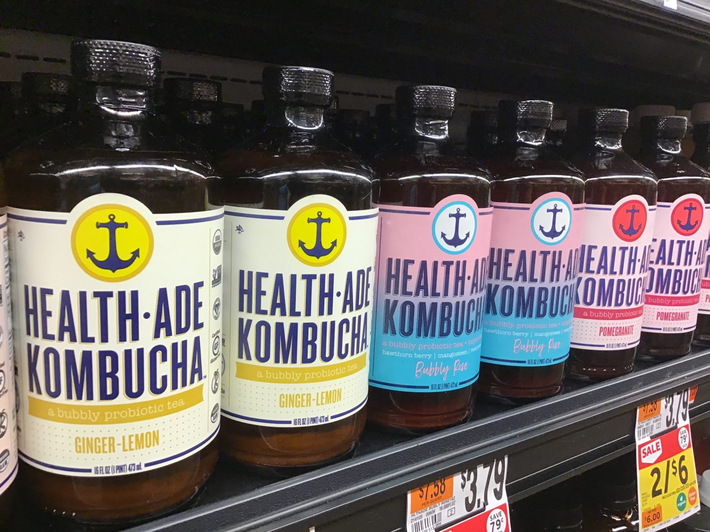 Bottles of kombucha for sale in a grocery storre.
